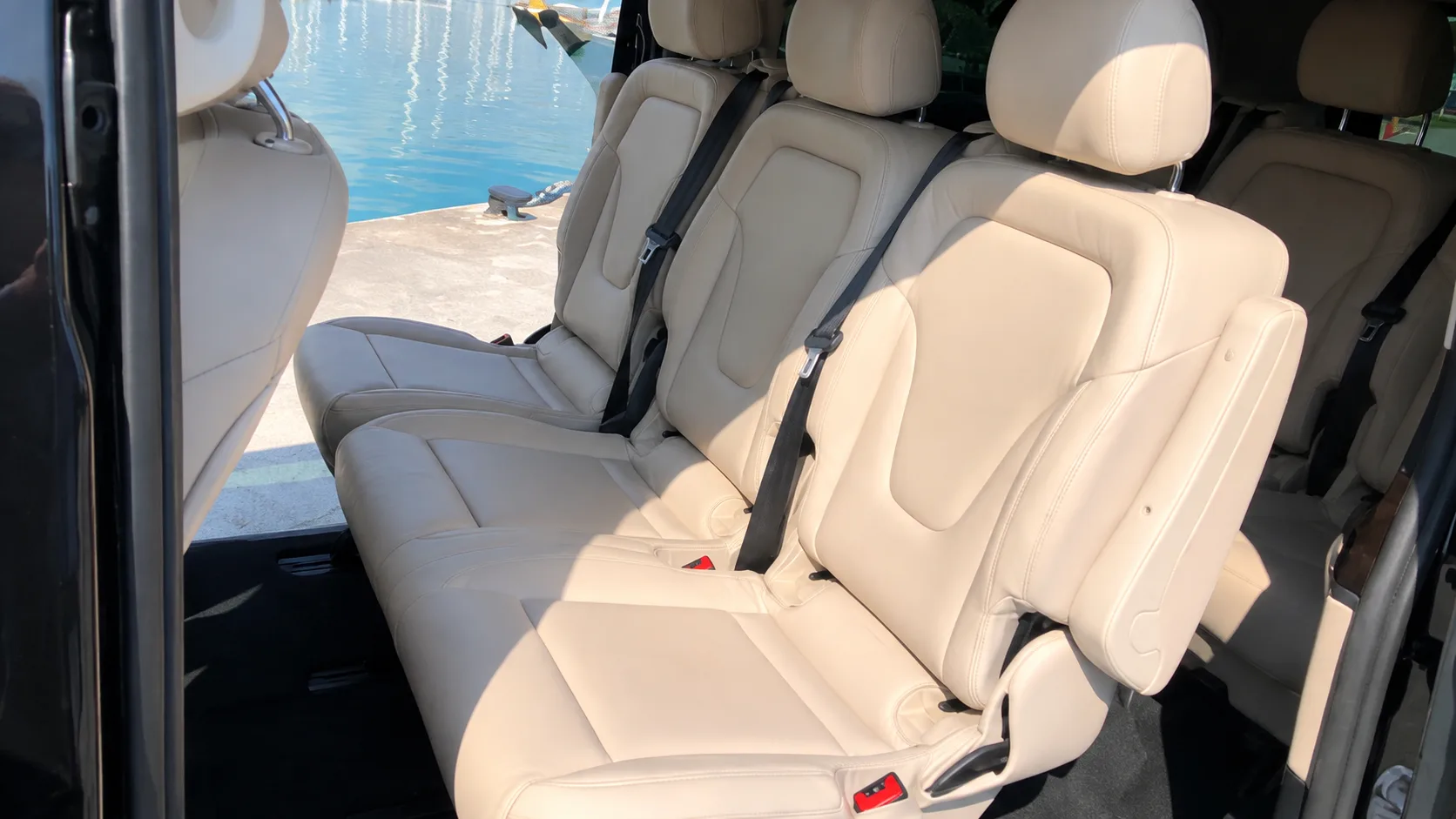 Cream leather rear seats in the V-Class, doors open on the water